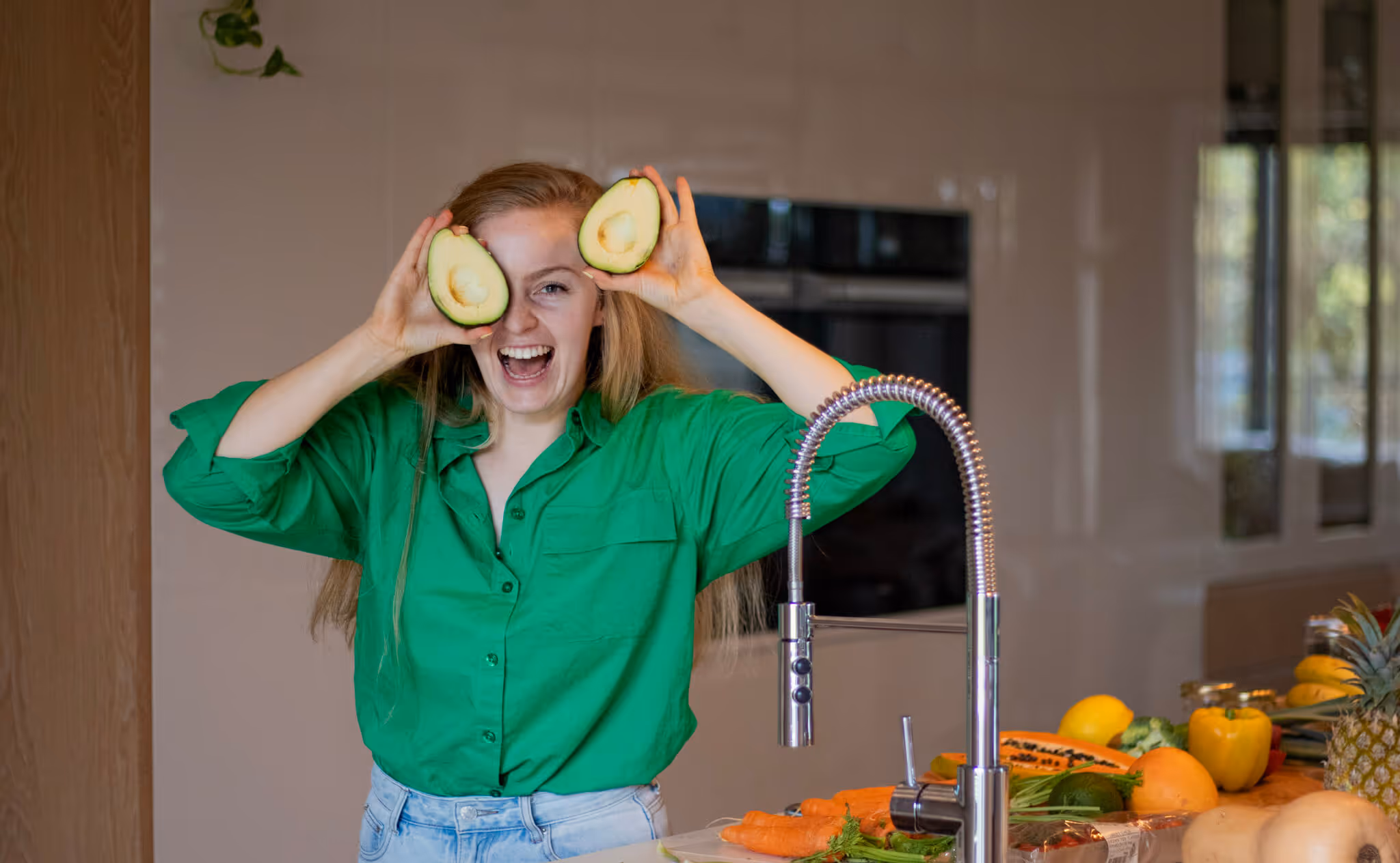 Fun photo with avocados infron of the eys