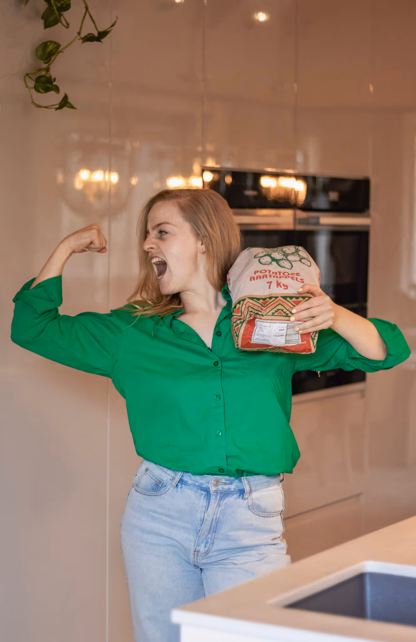 Tariena with a bag of potatoes on her shoulders